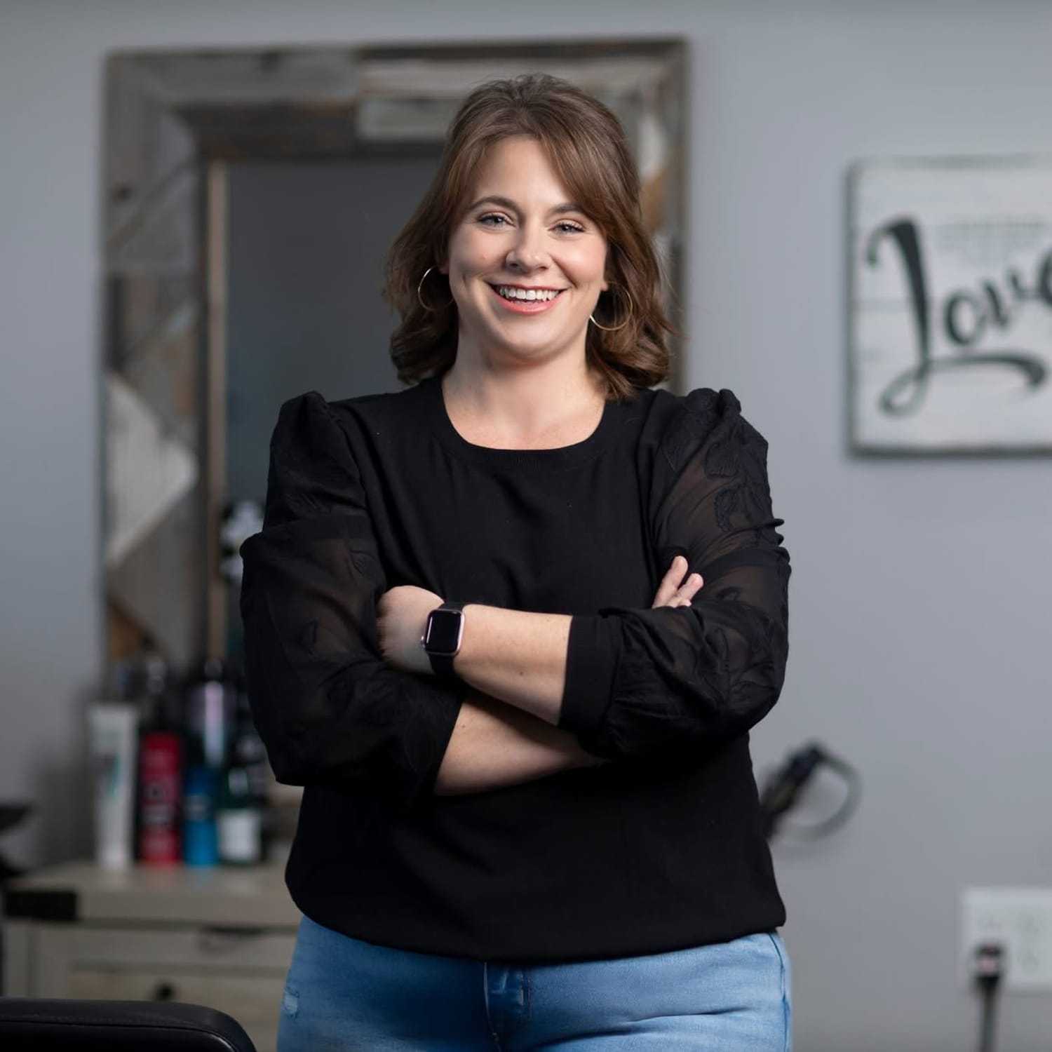 Portrait of Angelique Thomas, a professional stylist at A & M Inc., showcasing their expertise and style.